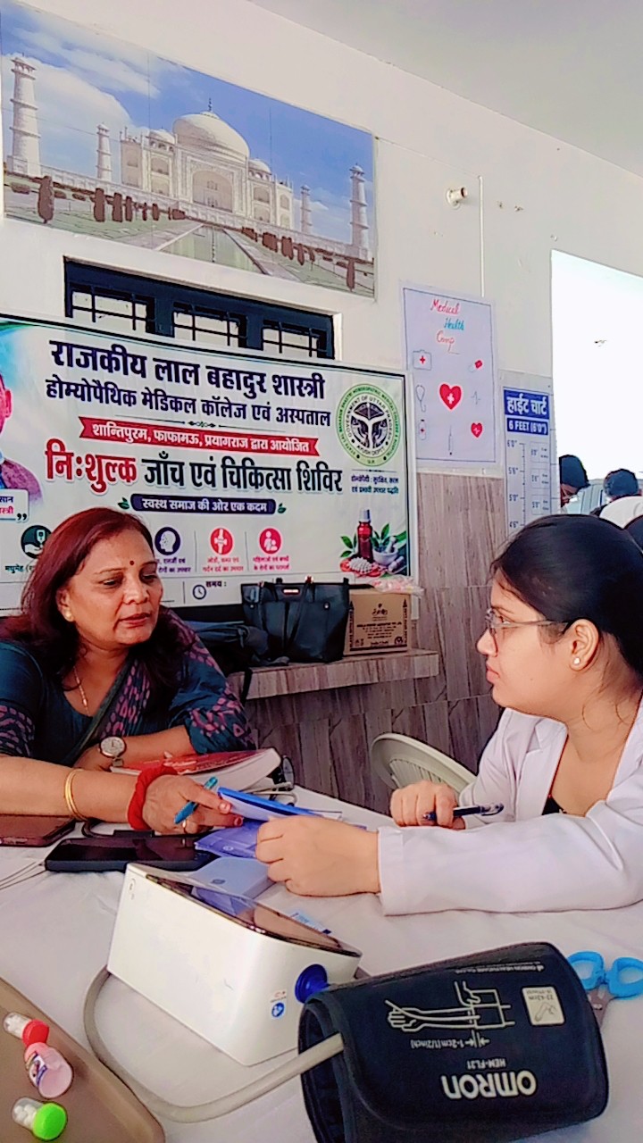 Dr. Geetika Agarwal checking a patient's blood pressure at the medical camp