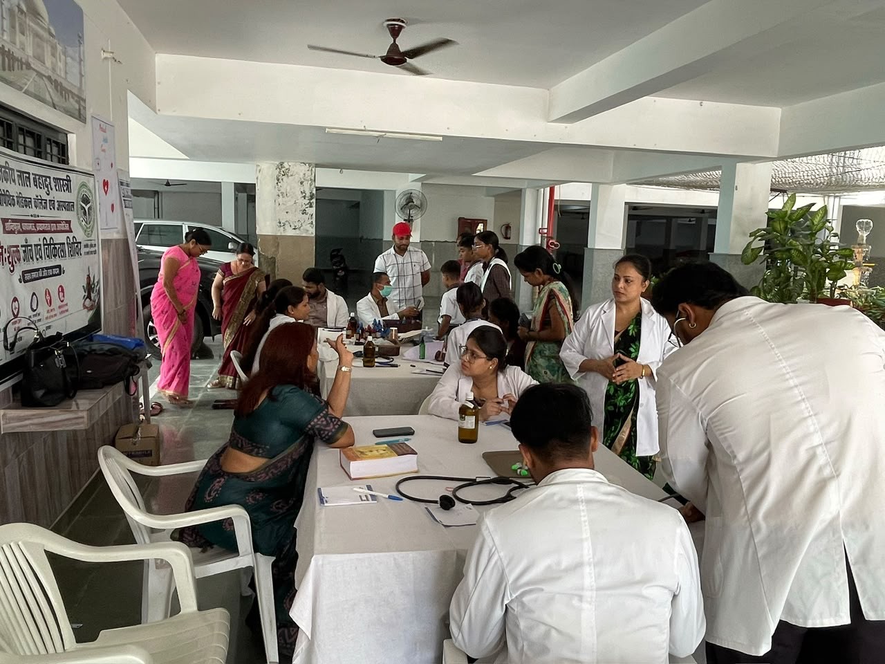 Doctors attending to patients at a free medical health camp