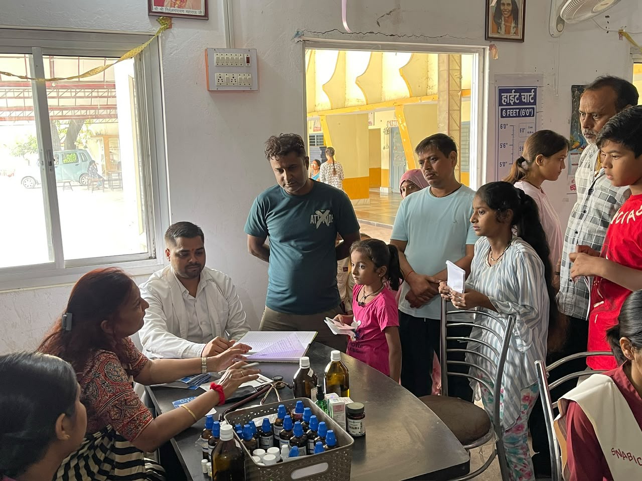 Doctors in consultation with a patient at the medical camp
