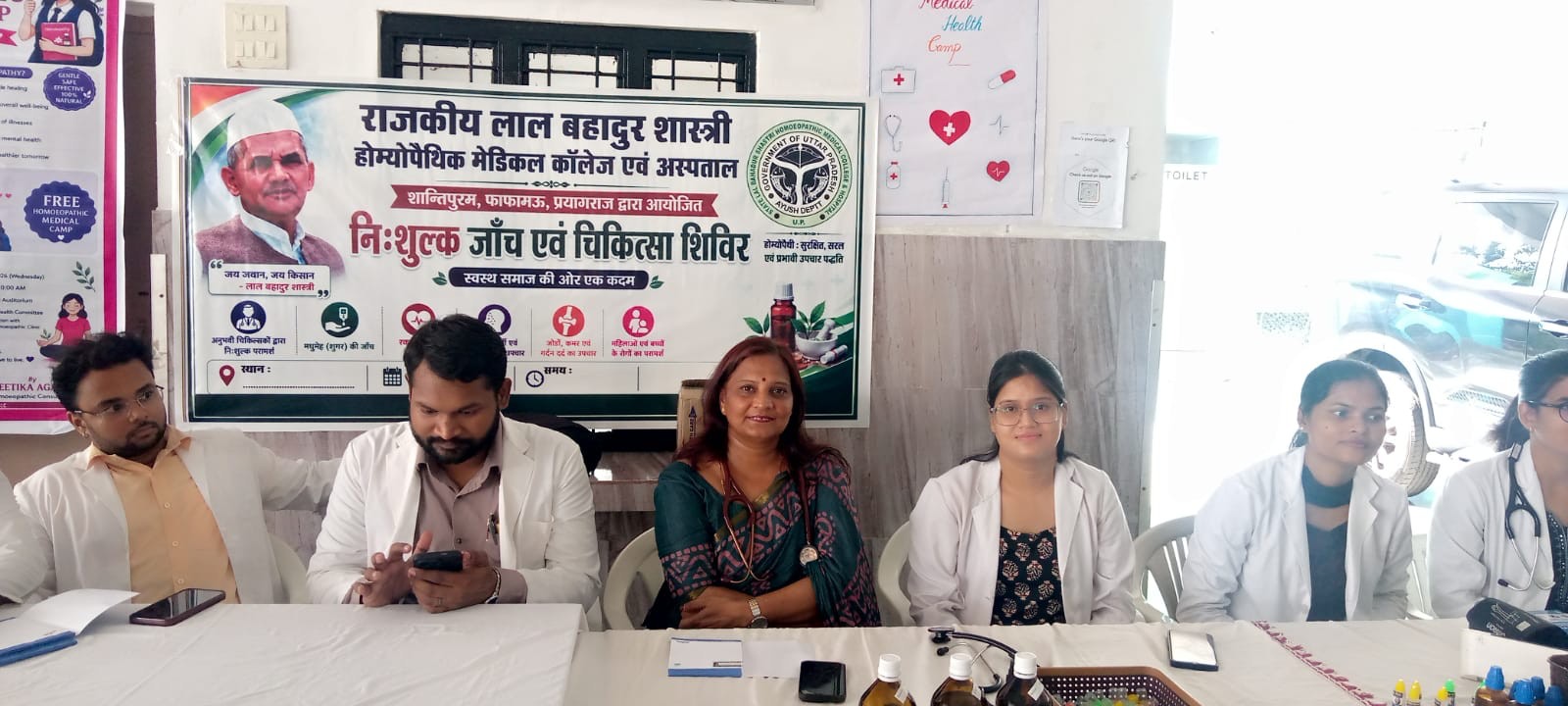 Dr. Geetika Agarwal and team seated at the medical camp desk